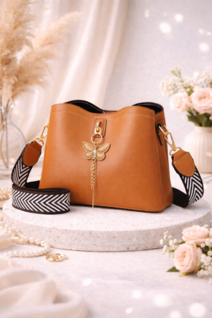 Tan Leather Bucket Bag for Women – Elegant Crossbody & Shoulder Handbag with Wide Strap and Butterfly Charm